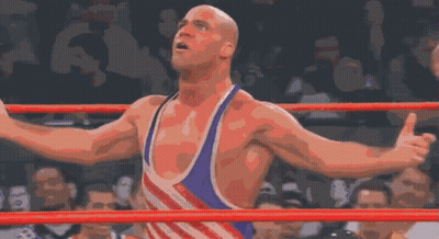 Wrestler Arms Outstretched In Ring With Crowd GIF