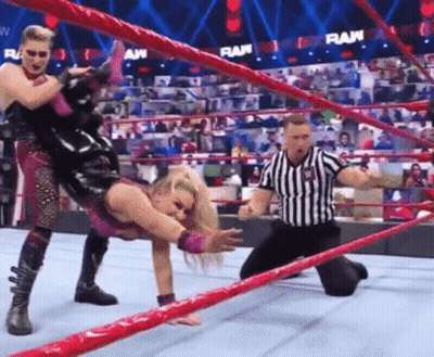 Wrestler Being Lifted By Another Wrestler In Ring GIF