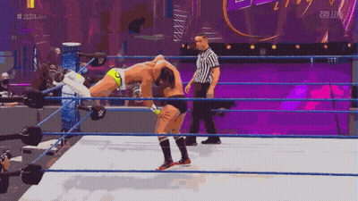 Wrestler Carrying Another On Shoulders In Ring GIF