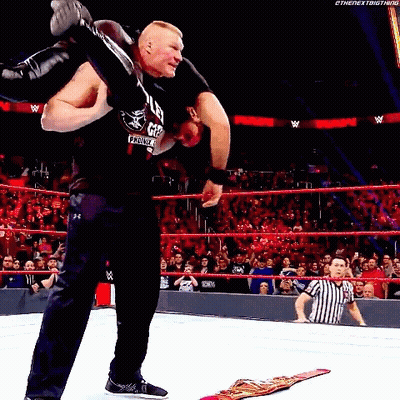 Wrestler Carrying Another Wrestler On Shoulders In Ring GIF