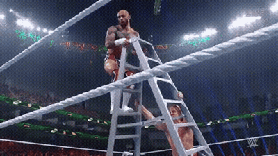 Wrestler Climbing Ladder Into Ring GIF
