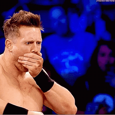 Wrestler Covering Mouth During Match GIF