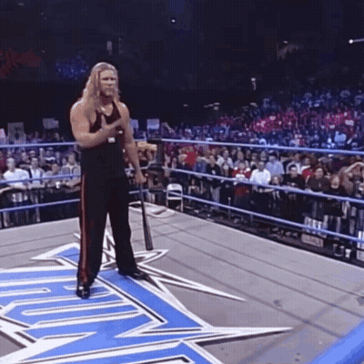 Wrestler Holding Baseball Bat In Ring GIF