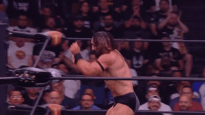 Wrestler Holding Belt In Ring GIF