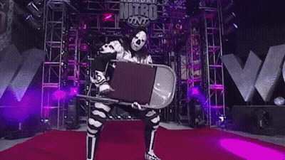 Wrestler Holding Chair On Red Carpet GIF