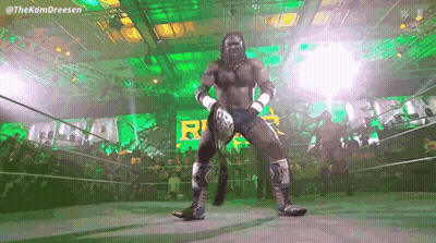 Wrestler Holding Championship Belt GIF