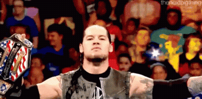 Wrestler Holding Championship Belt Before Crowd GIF