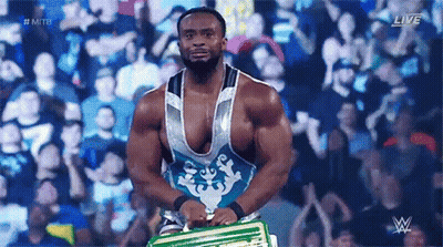 Wrestler Holding Championship Belt In Front Of Crowd GIF