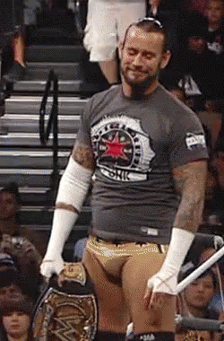 Wrestler Holding Championship Belt GIF