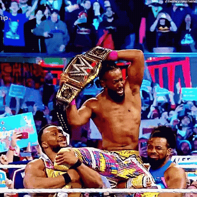 Wrestler Holding Championship Belt GIF