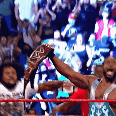 Wrestler Holding Championship Belt GIF