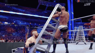 Wrestler Holding Ladder In Match GIF