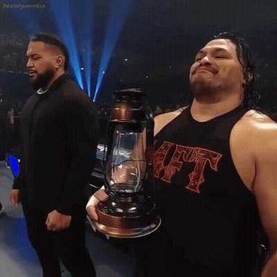 Wrestler Holding Lantern With HT Shirt GIF