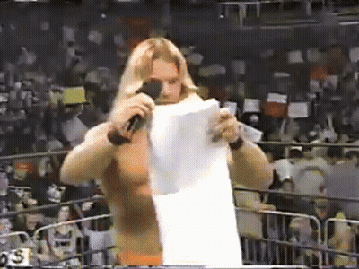 Wrestler Holding Paper In Front Of Microphone GIF
