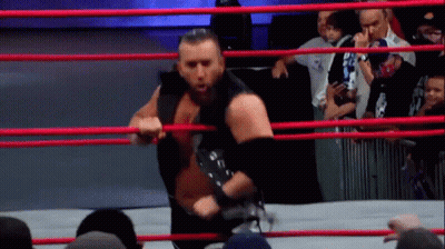 Wrestler Holding Rope In Ring GIF