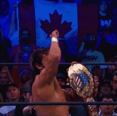 Wrestler Holding United States Championship Belt GIF