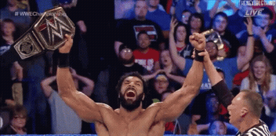 Wrestler Holding Up WWE Championship Belt GIF
