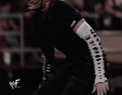Wrestler In Black Shirt With WF On Sleeve GIF