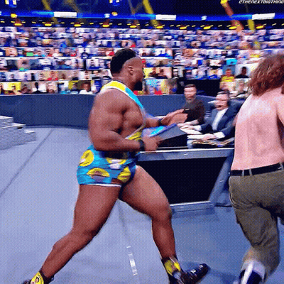 Wrestler In Blue And Yellow Outfit Running GIF