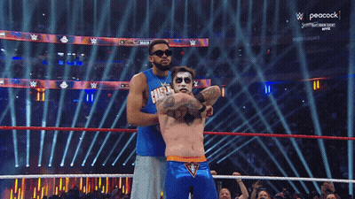Wrestler In Blue Shirt Saying Champion GIF