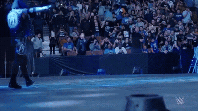 Wrestler In Blue Shirt With P GIF