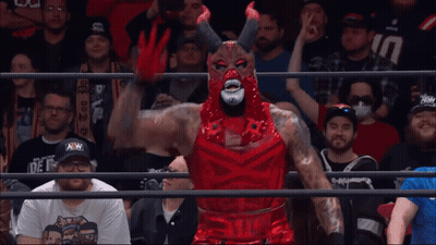 Wrestler In Devil Costume Before Crowd GIF
