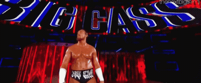 Wrestler In Front Of Big Cass Sign GIF