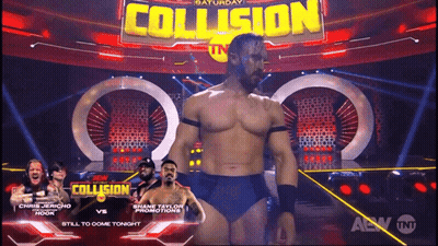 Wrestler In Front Of Collision Sign GIF