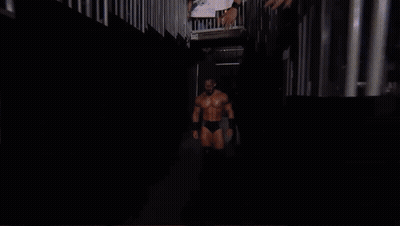 Wrestler In Front Of Crowd With Supercard Sign GIF