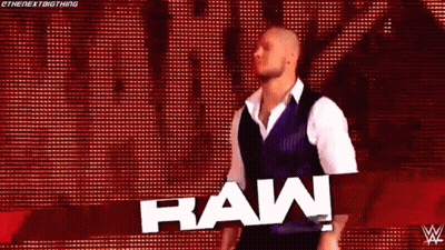 Wrestler In Front Of Raw Sign GIF