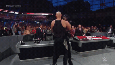 Wrestler In Front Of Royal Rumble Table GIF