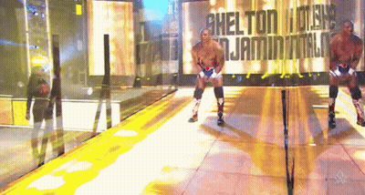 Wrestler In Front Of Wall Saying Shelton GIF