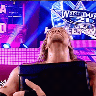 Wrestler In Front Of Wrestlemania 21 Sign GIF