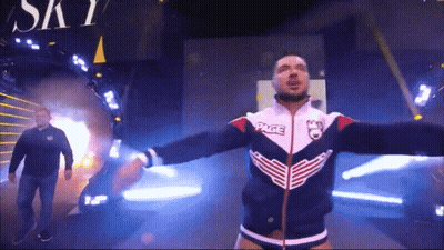 Wrestler In Jacket Saying Page GIF