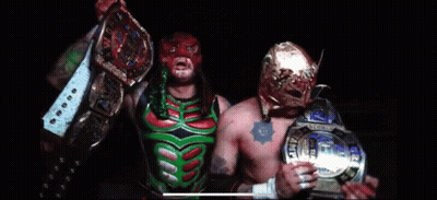 Wrestler In Purple And Green Walking Down Runway GIF