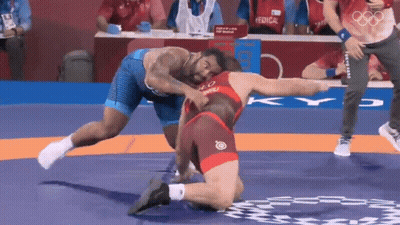 Wrestler In Red And Blue Vs Blue And White GIF