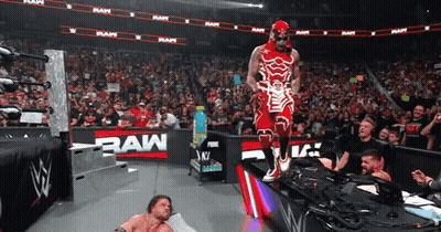 Wrestler In Red And White By RAW Sign GIF
