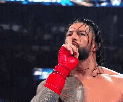 Wrestler In Red Glove Covering Mouth GIF