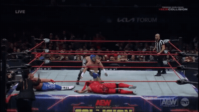 Wrestler In Red Kicking Another Wrestler GIF