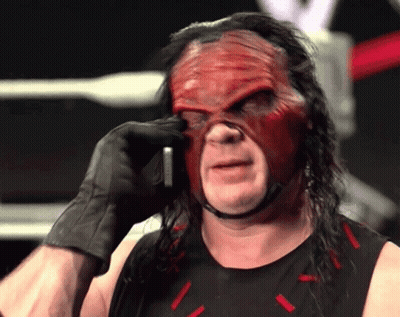 Wrestler In Red Mask And Black Gloves On Phone GIF