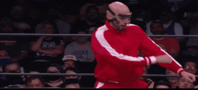 Wrestler In Red Suit Doing Flip GIF