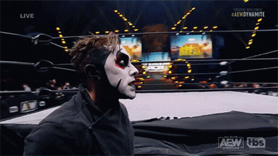 Wrestler In Ring With AEW Dynamite Logo GIF