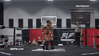 Wrestler In Ring With #BLPIsBack Sign GIF