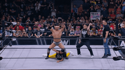 Wrestler In Ring With Jeff Watt Sign GIF