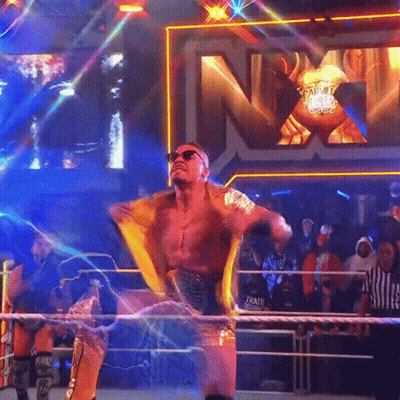 Wrestler In Ring With NXT Sign GIF