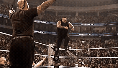 Wrestler In Ring With Smack On Walls GIF
