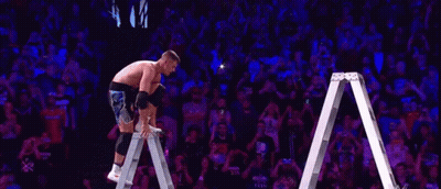 Wrestler In Ring With Star Deliver Sign GIF