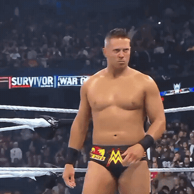 Wrestler In Ring With Survivor War Behind Him GIF