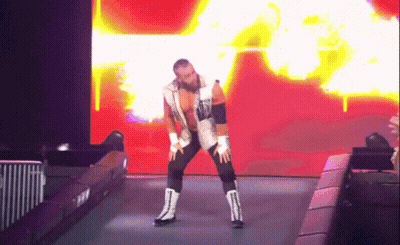 Wrestler In White Vest And Black Pants Dancing GIF