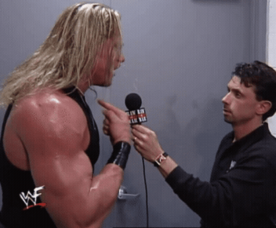 Wrestler Interviewed By Man In WWE Shirt GIF